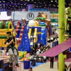 Sky-Rail-little-boy-participant-riding-IAAPA-RCI-Adventure-Products