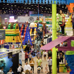 Sky-Rail-participant-riding-rigid-zipline-trade-show-IAAPA-2019