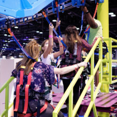 Sky-Trail-Operator-with-parents-and-kids-IAAPA-2019-RCI-Adventure-Products-1