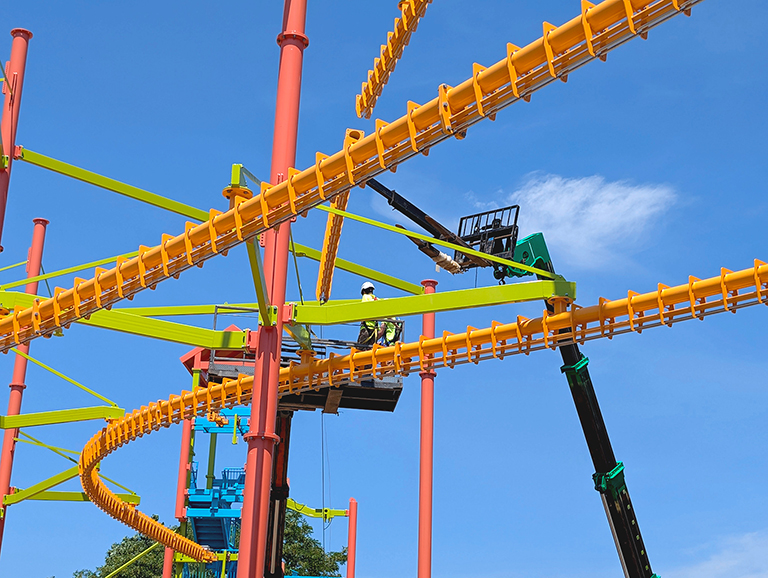 A Sky Rail® being lifted into place by a crane, as part of the construction of the new Sky Tour® course at Allegan Event.
